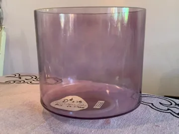 cr=w_360,h_270 A purple glass vase sitting on top of a table.