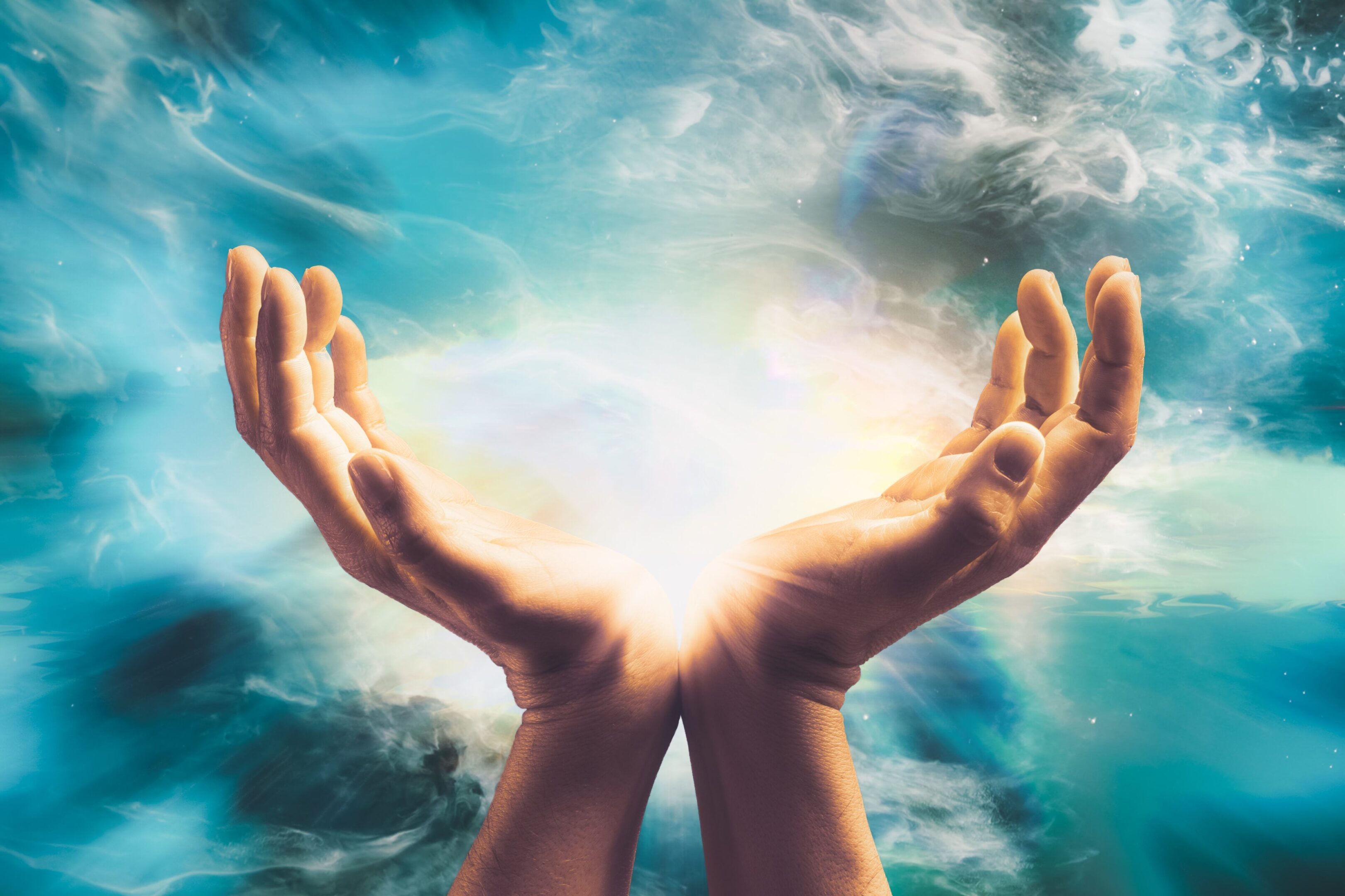 jpeg-optimizer_GettyImages-1388352391 A person with their hands open in the air.