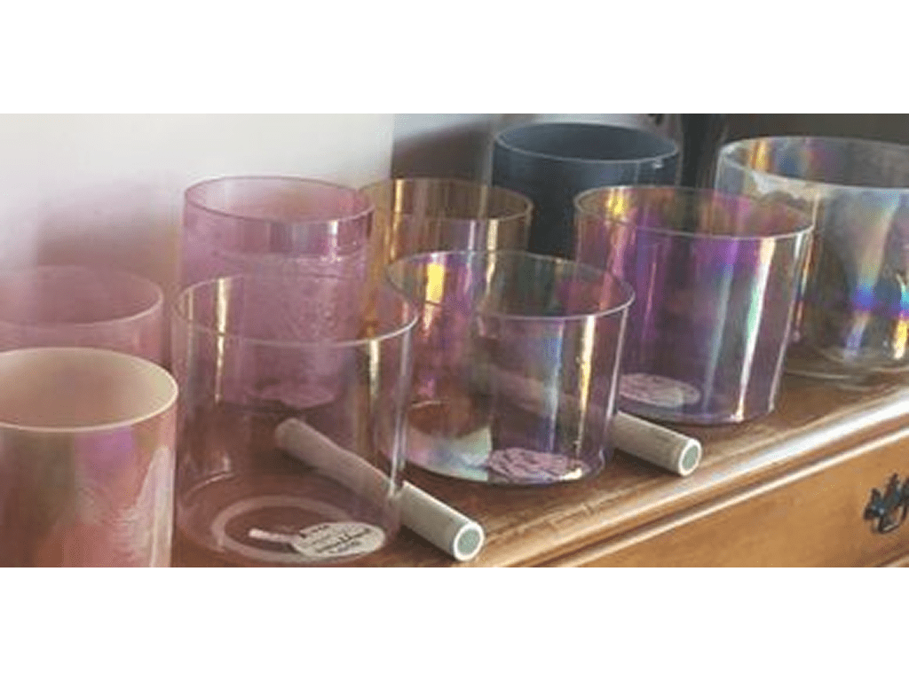 rs=w_1280 (3)-5 A wooden shelf with many different colored glasses.
