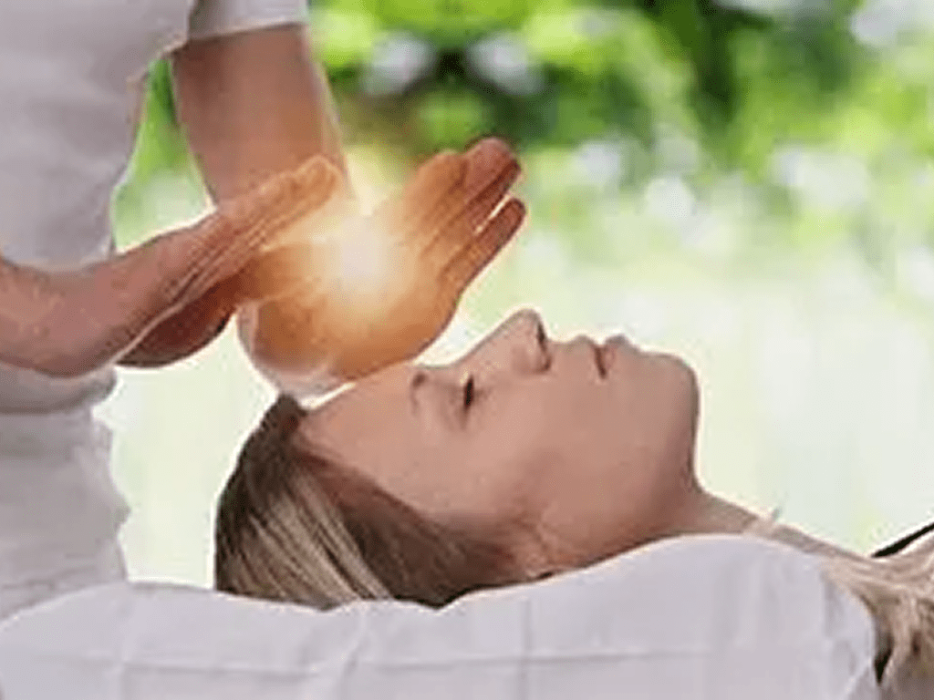 A person is being given reiki treatment
