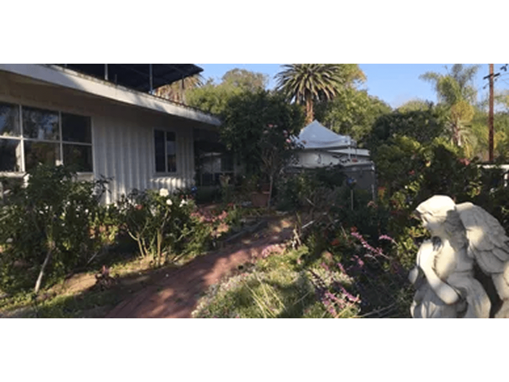 rs=w_1280 (3)-7 A garden with a white statue and a house.