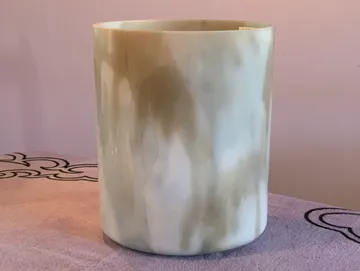 rs=w_360,h_271,cg_true (1) A cup that is sitting on top of a table.