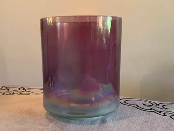 rs=w_360,h_271,cg_true A purple glass cup sitting on top of a table.