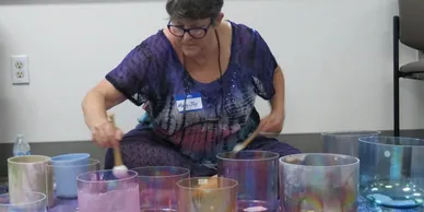 rs=w_388,h_194,cg_true (1) A woman is playing with some drums