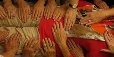 rs=w_388,h_194,cg_true (2) A group of people with their hands together.