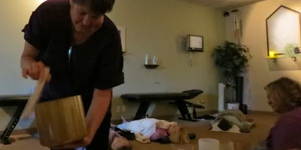 rs=w_600,h_300,cg_true (5) A woman standing in front of a baby laying on the floor.